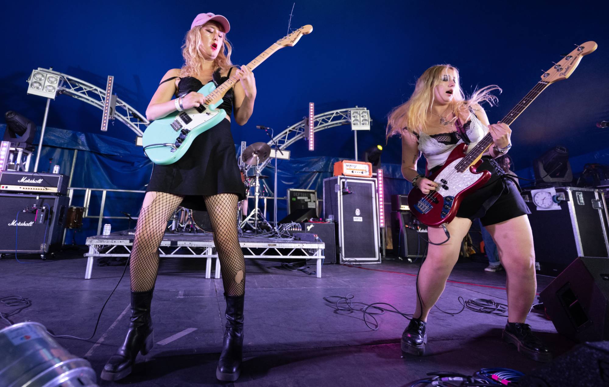 Phoebe Lunny and Lilly Macieira-Boşgelmez of Lambrini Girls perform at 2000 Trees Festival at Upcote Farm on July 6, 2023 in Cheltenham, England. Credit: Katja Ogrin via Getty