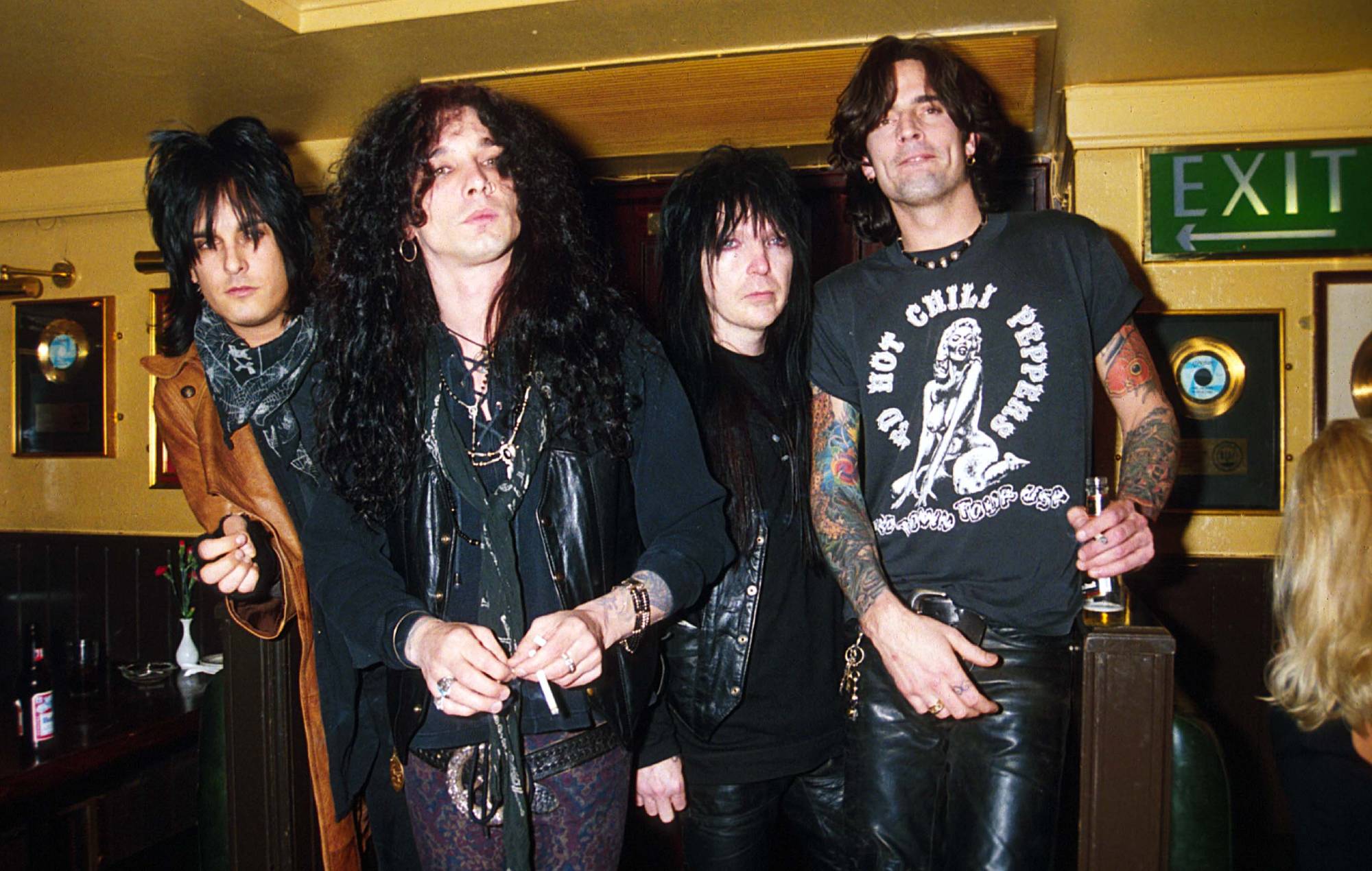 Nikki Sixx, John Corabi, Mick Mars and Tommy Lee of Motley Crue pose at the Hard Rock Cafe, February 1994, in London, England. (Photo by Dave Benett/Getty Images)