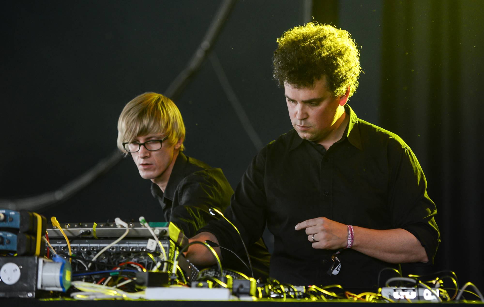 Jas Shaw and James Ford of DJ/Producer duo Simian Mobile Disco perform on stage at Field Day Festival 2014. (Photo by Andy Sheppard/Redferns via Getty Images)