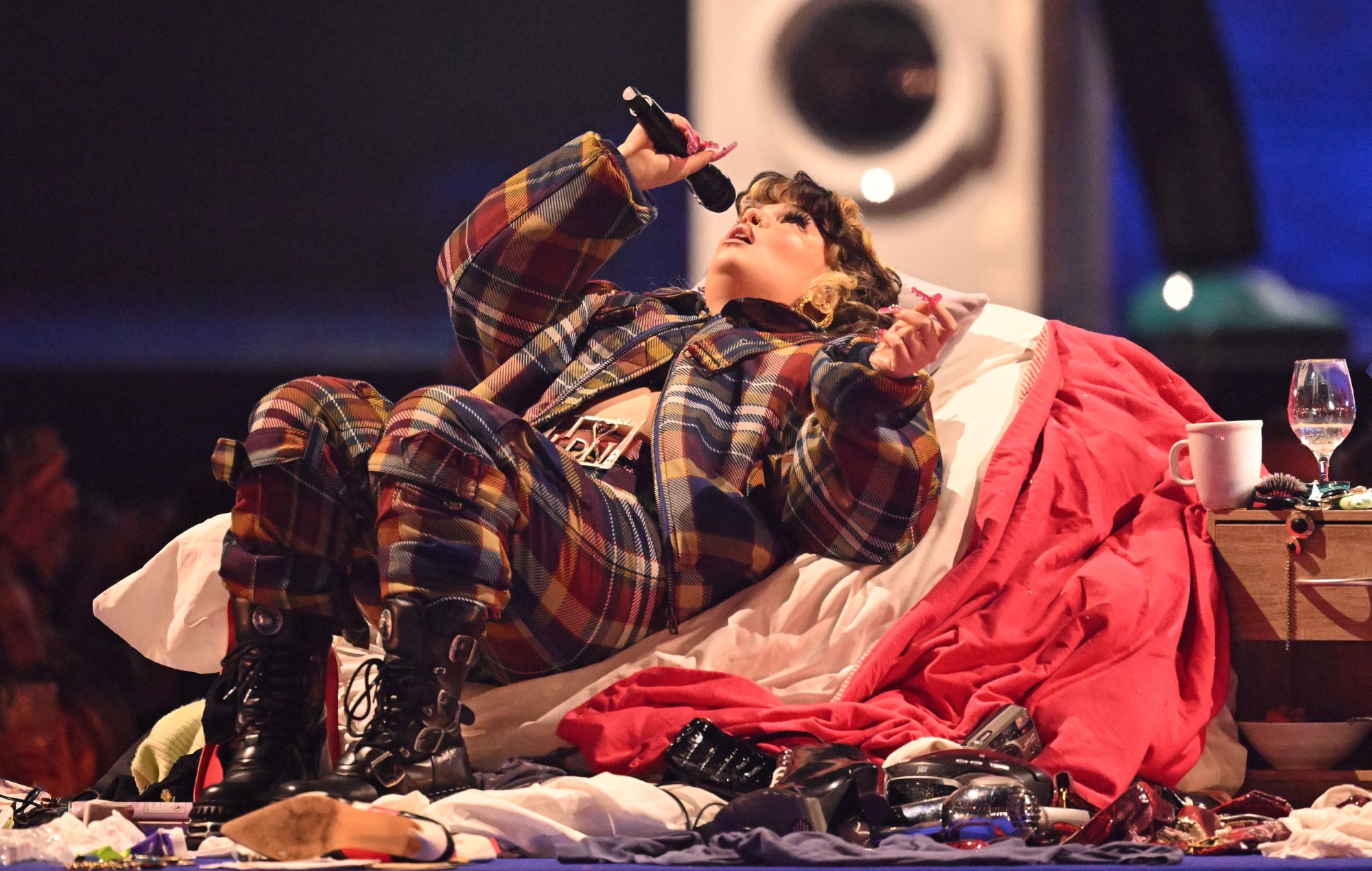 Lola Young performs on stage during The BRIT Awards 2025